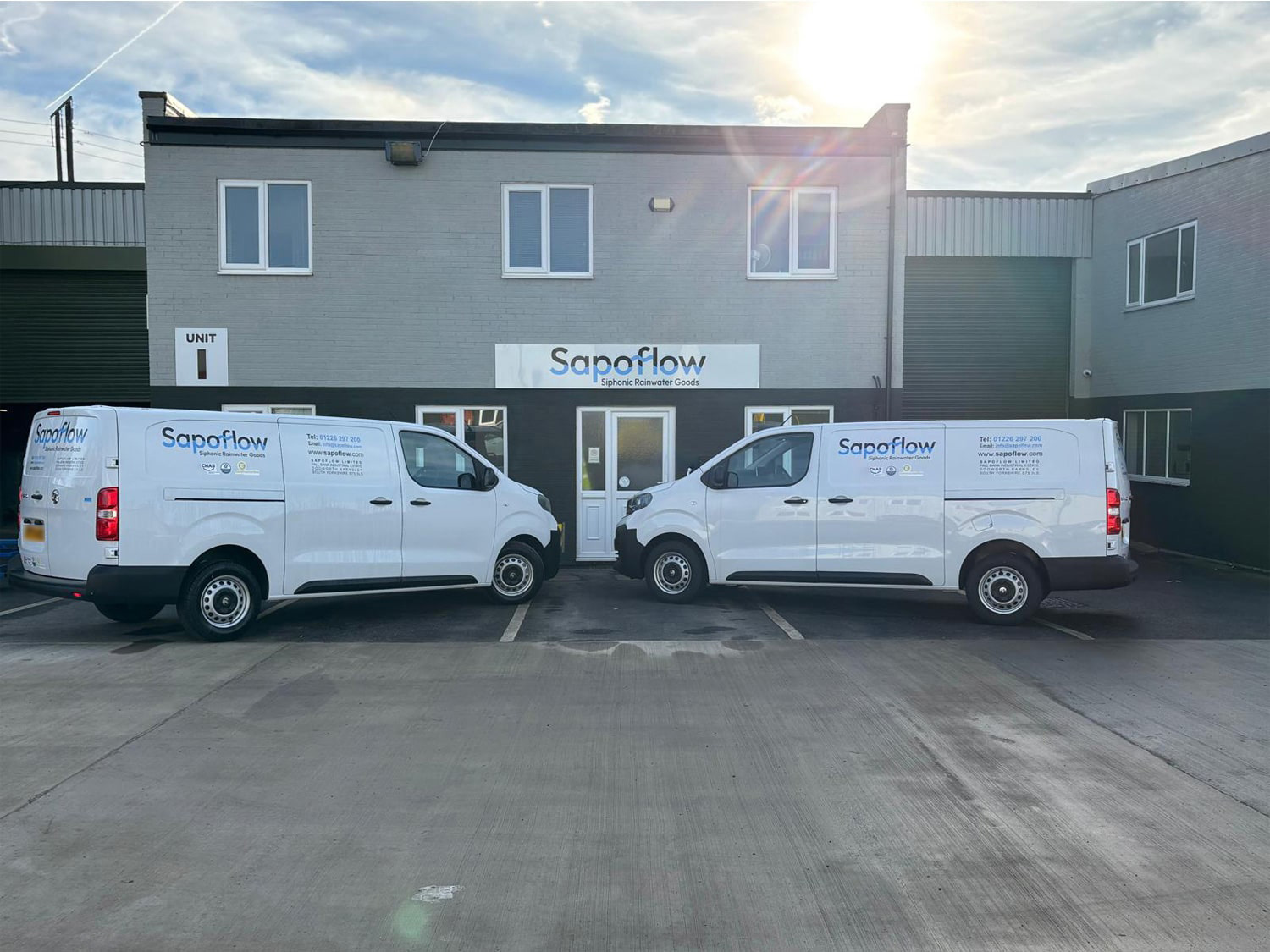 Image of Sapoflow's vans at their office.